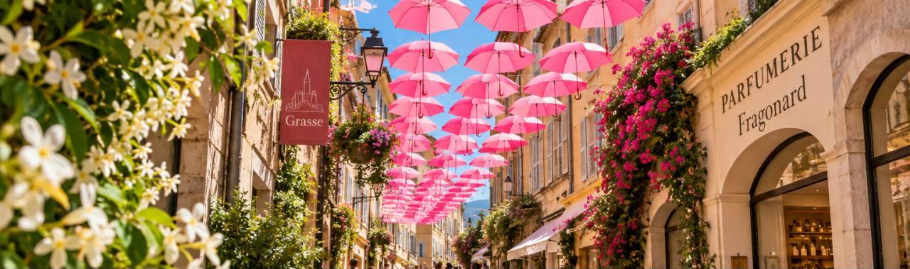 Pink umbrellas in the historic streets of Grasse